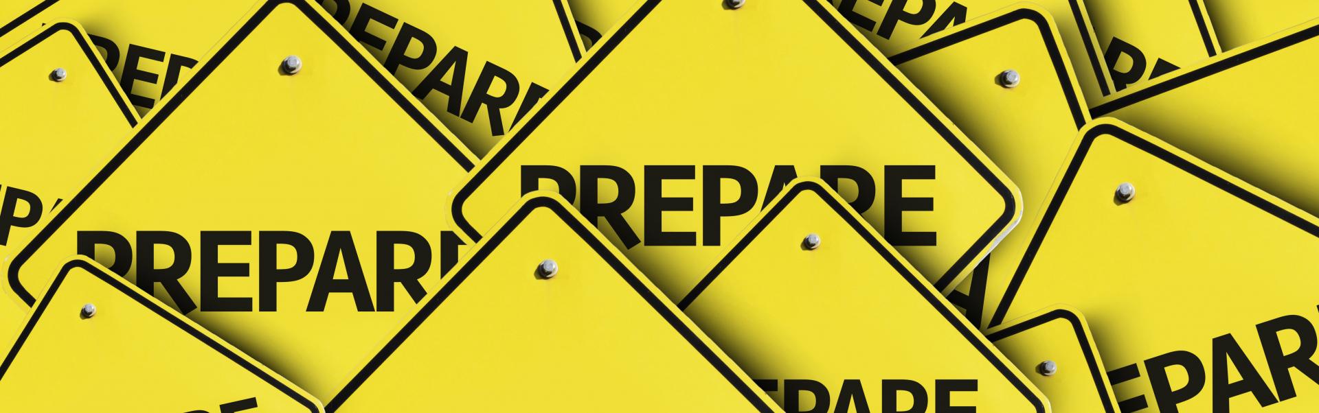 Yellow signs displaying the word "prepare"